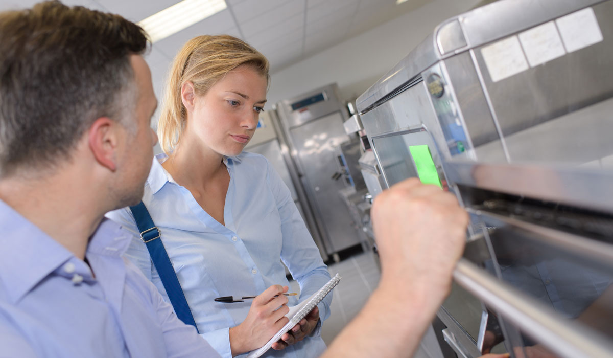 Audit Taking Place In A Restaurant Kitchen