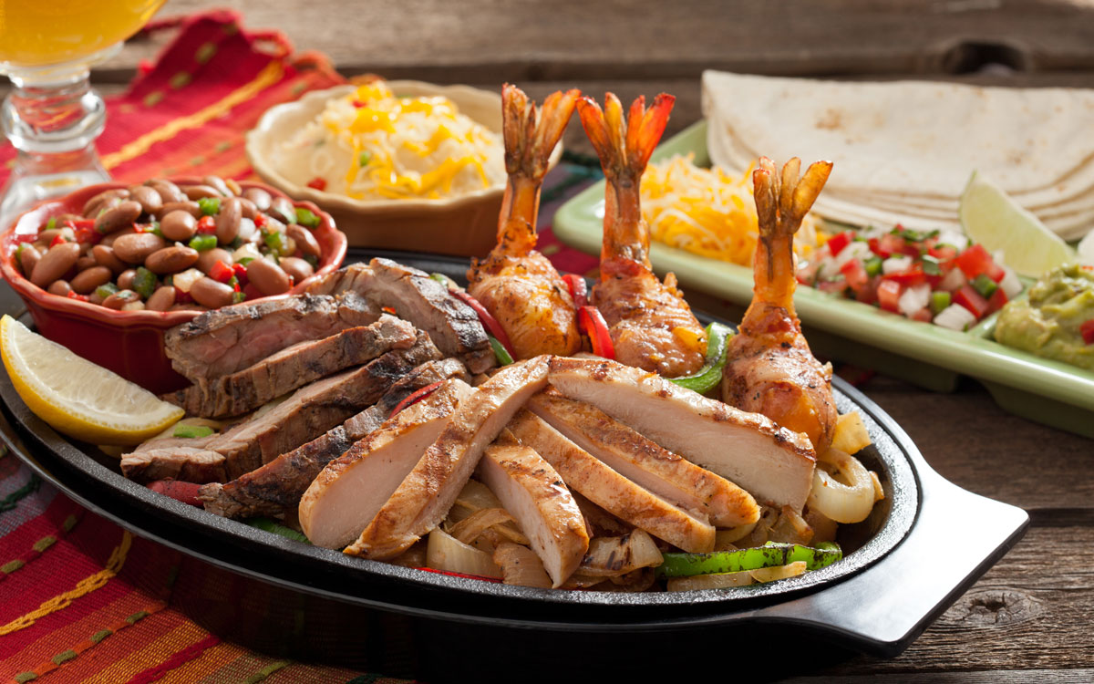 Sizzling Plate Of Mexican Food At Abuelo's