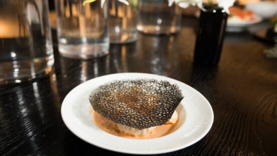 Steamed shrimp lobster dumpling with spicy tamarind ginger emulsion.