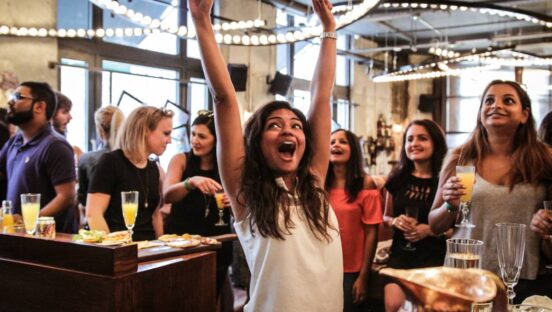 Customer celebrating at Flight Club.