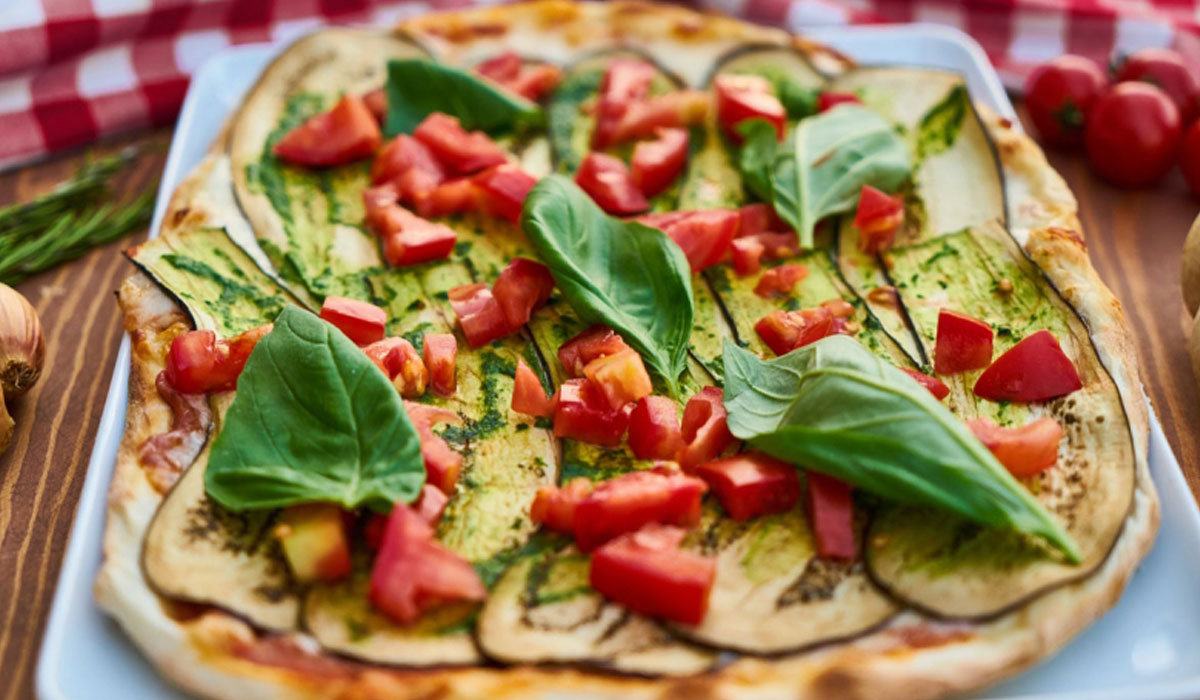 A Pizza With Basil And Tomatoes