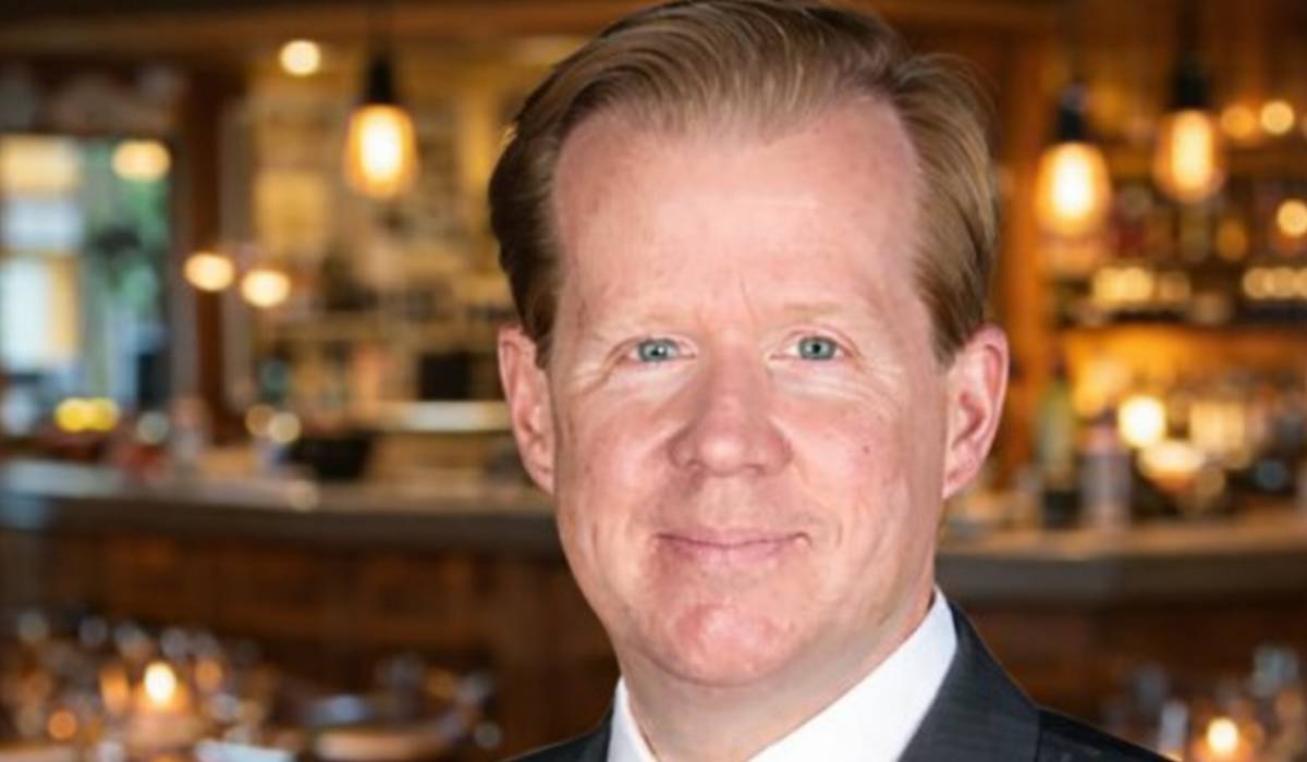Photo of James O'Reilly against a restaurant background.