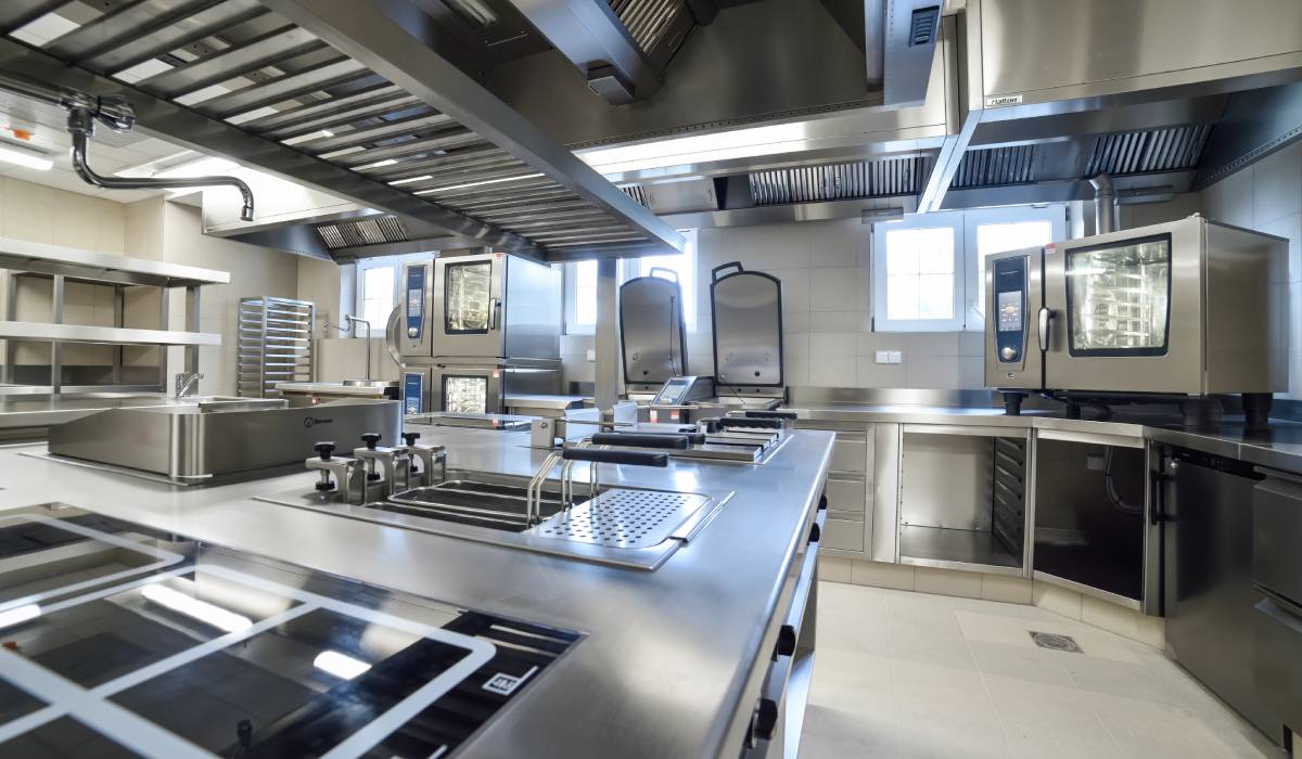 A stainless steel kitchen in a restaurant.