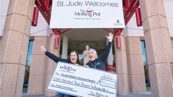 Melting Pot giving a check to St. Jude Children's Research Hospital.