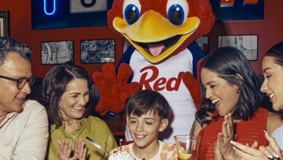 Red Robin mascot with customers.