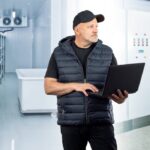 Man in refrigeration section.