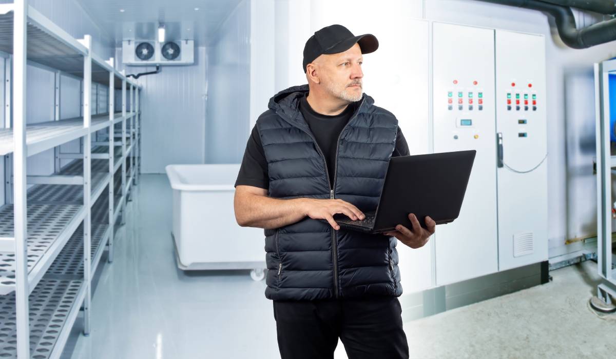 Man in refrigeration section.