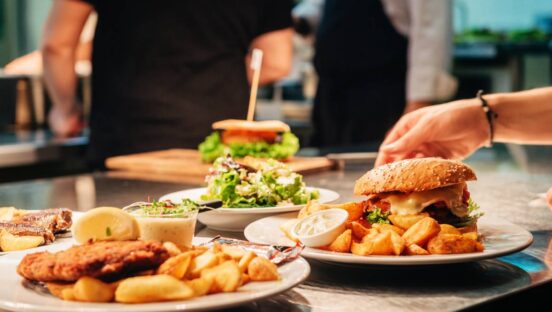 Food orders on the kitchen table in the restaurant.
