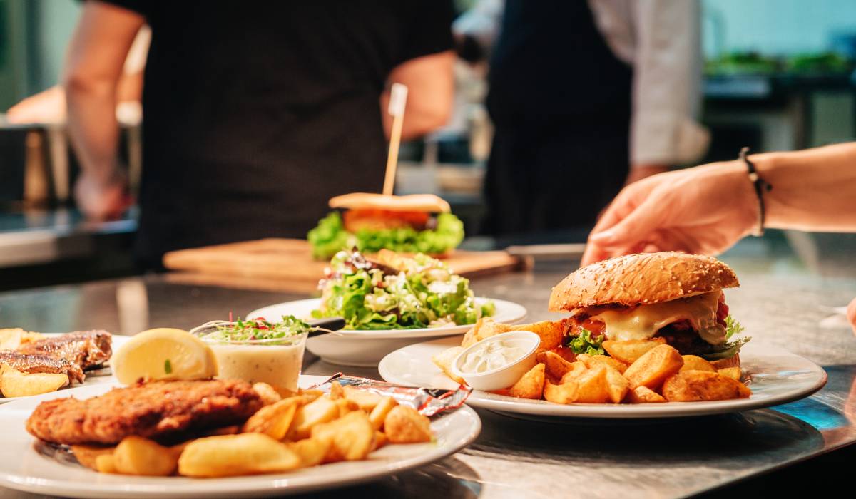 Food orders on the kitchen table in the restaurant.