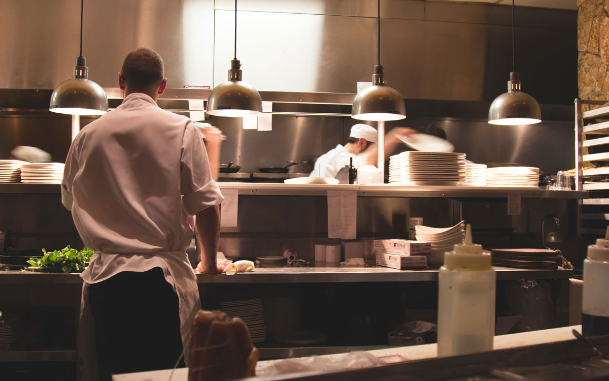 Chefs At Work In A Restaurant Kitchen