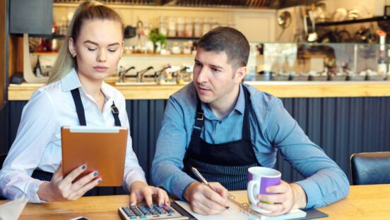 Employees looking over finances.