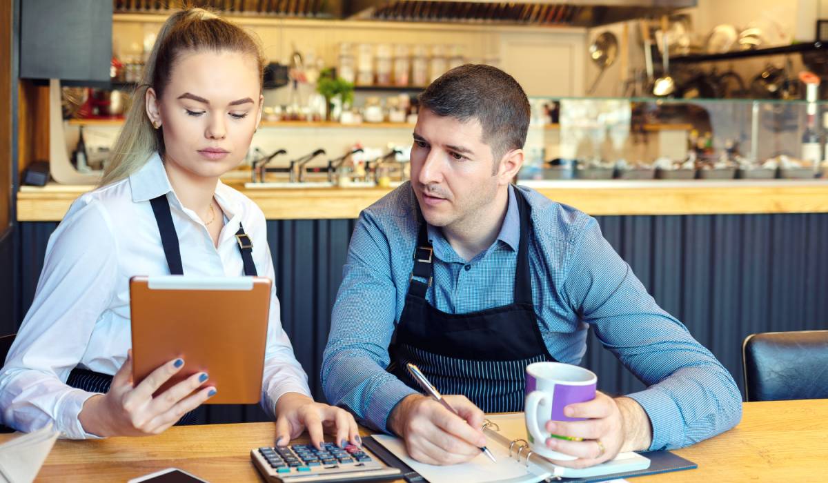 Employees looking over finances.