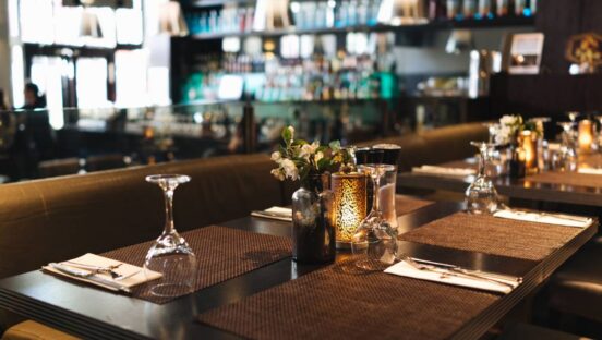 Empty restaurant table with glasses.