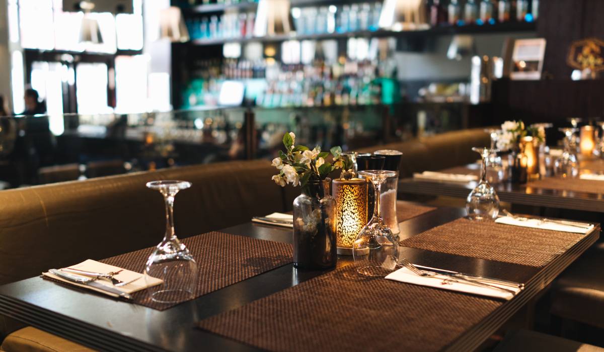 Empty restaurant table with glasses.