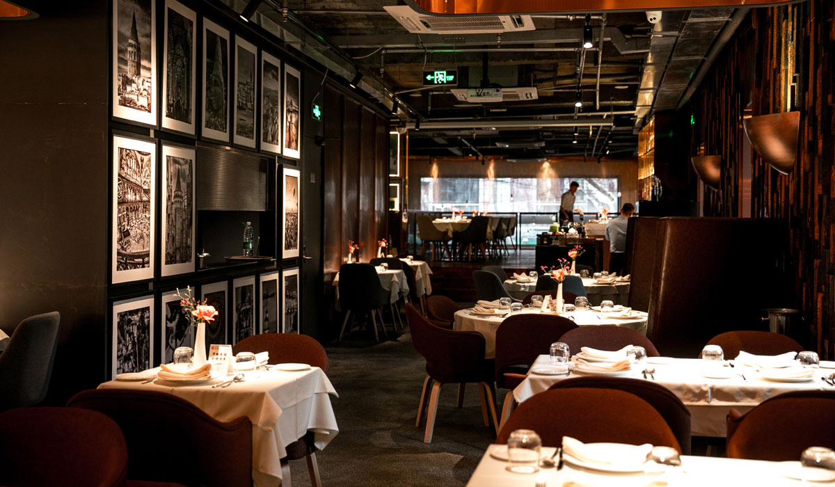 Inside An Empty Restaurant With White Tables