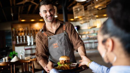 A waiter serving food.